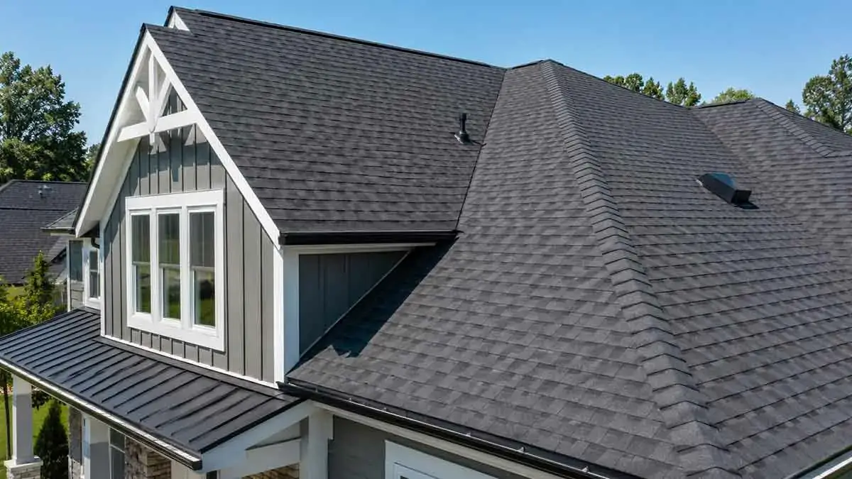 Well-maintained residential roof with clean gutters and roofing materials